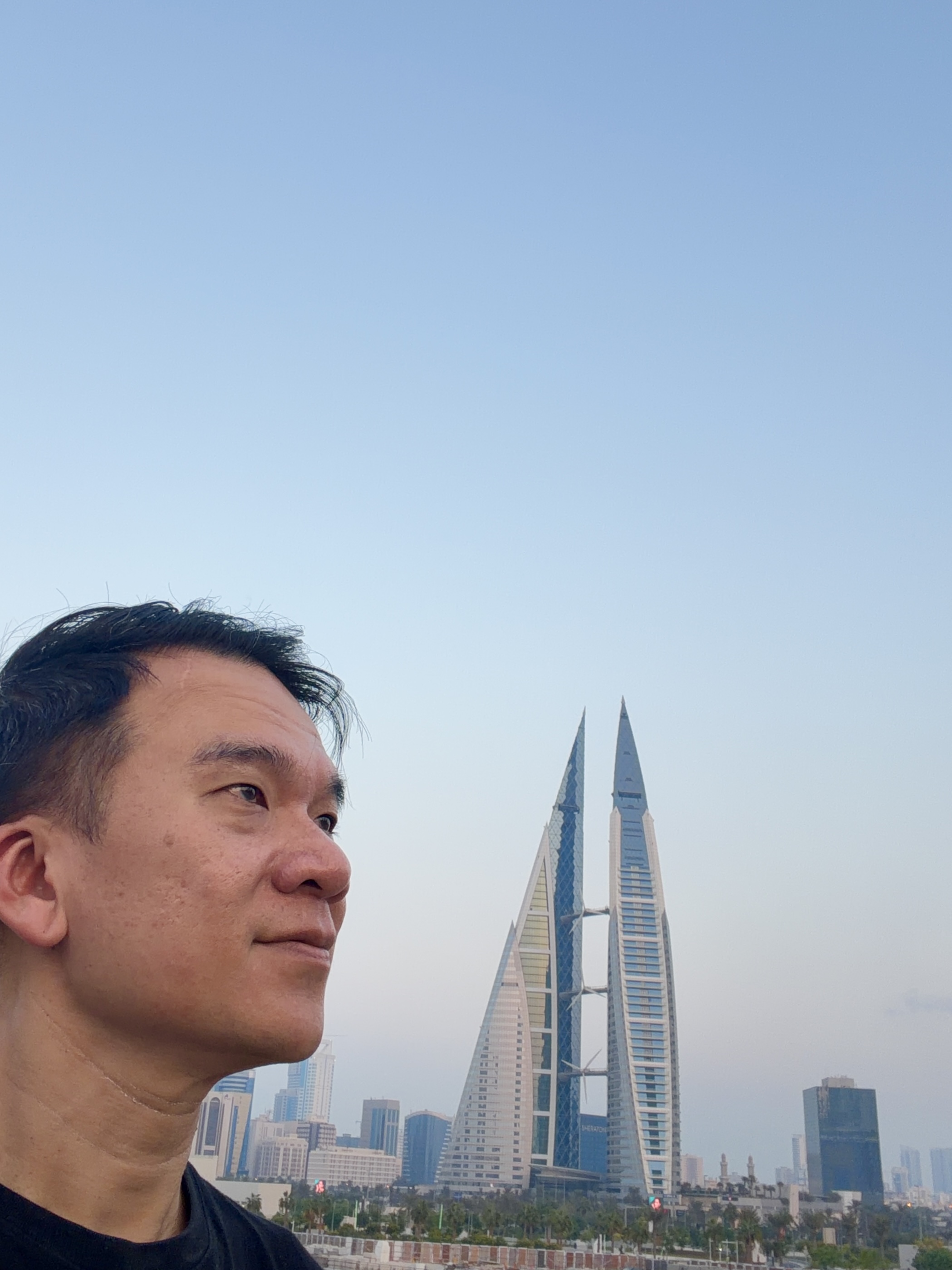Looking toward the Bahrain World Trade Center twin towers at dusk
