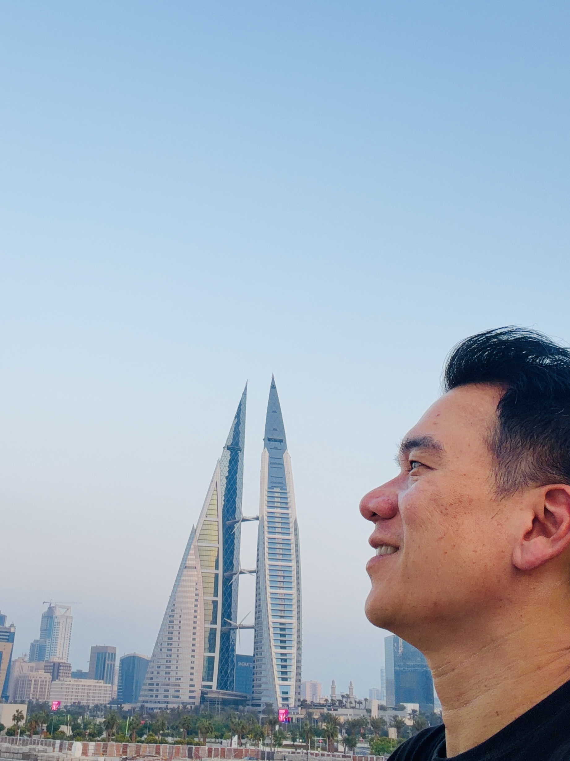 Gazing toward the twin World Trade Center towers over the Manama skyline