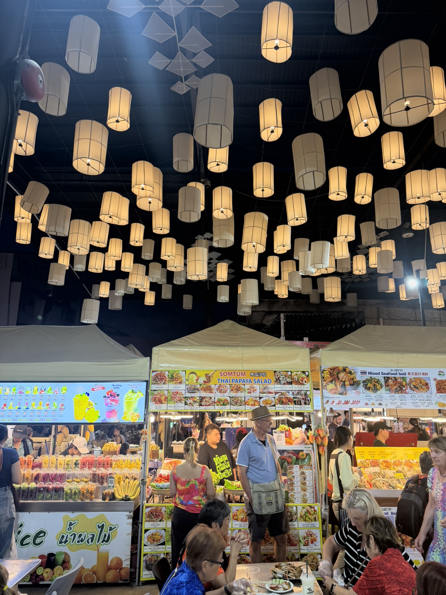 Chiang Mai night market with glowing lanterns overhead