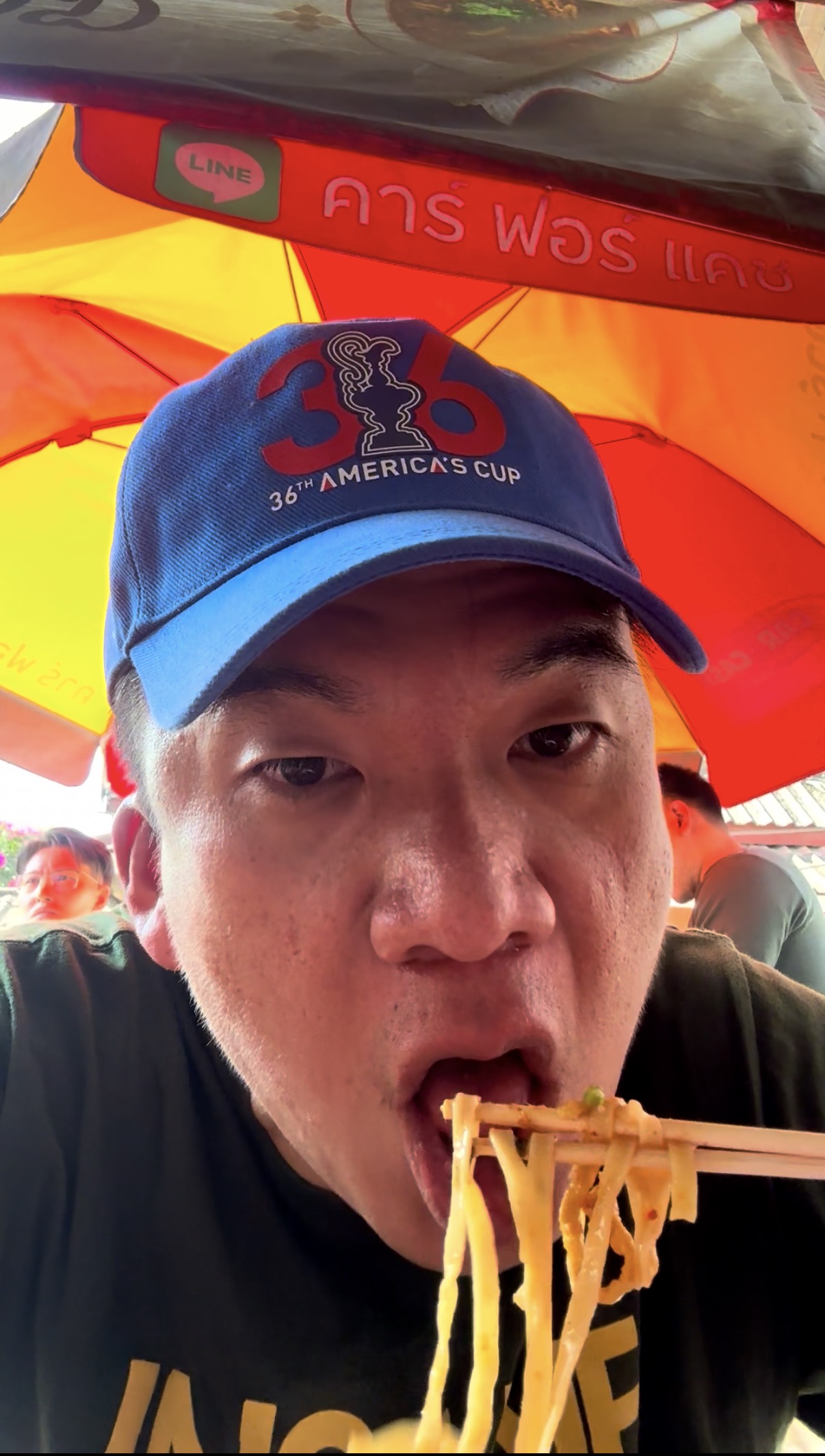 Enjoying Khao Soi noodles at a street stall in Chiang Mai