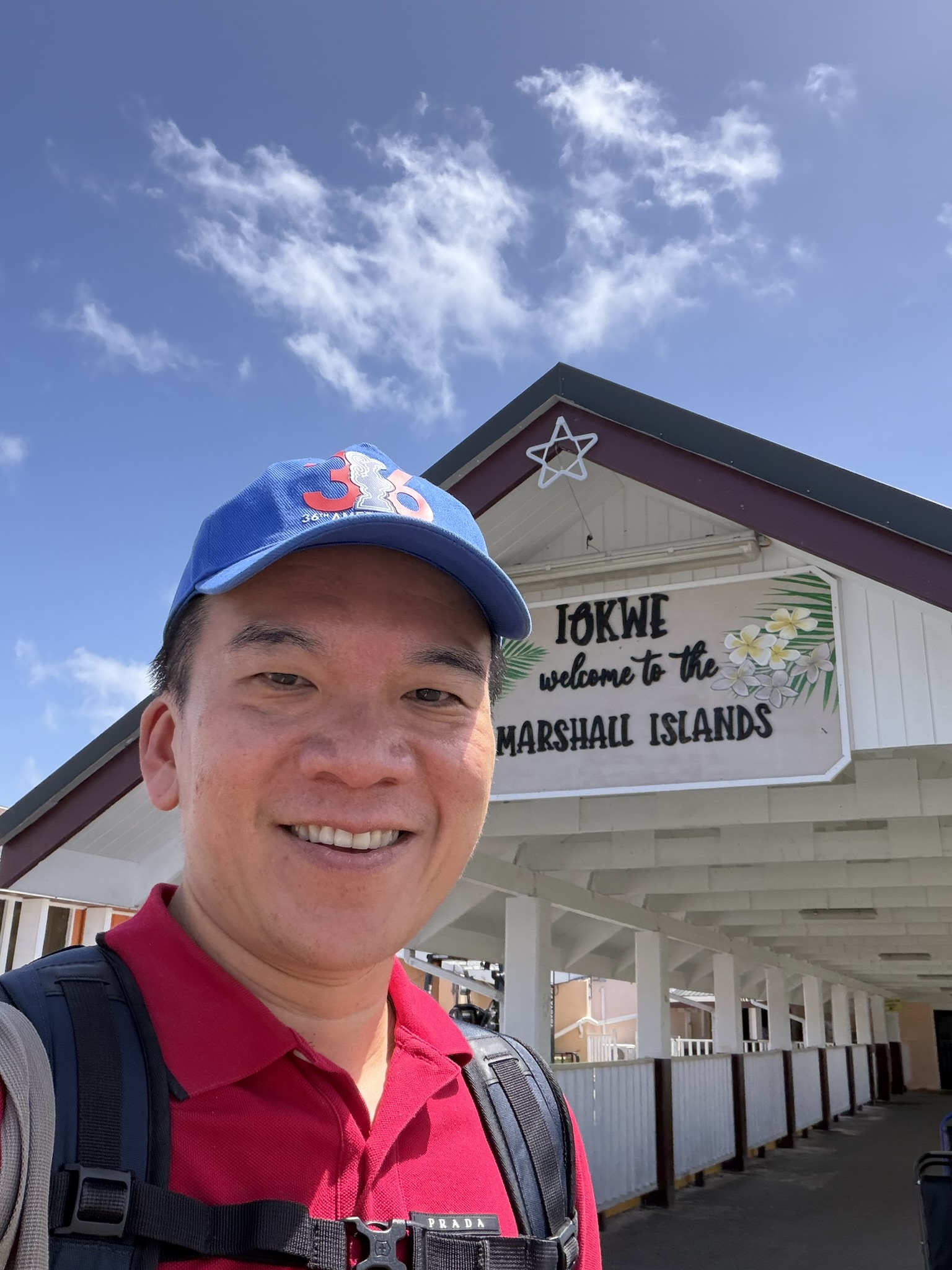 Andrew at the Welcome to Marshall Islands sign