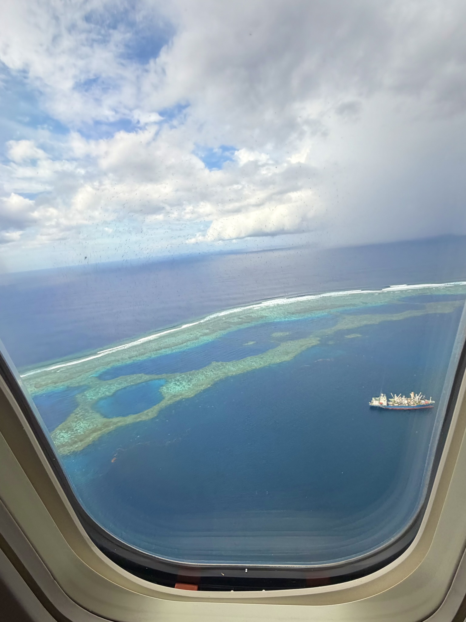 View through plane window of Pohnpei reef