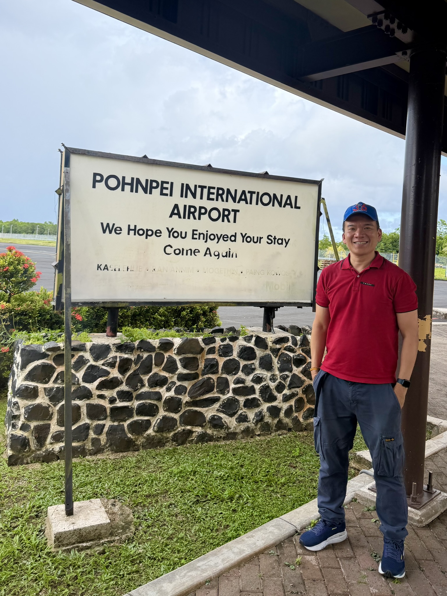 Andrew at Pohnpei International Airport sign