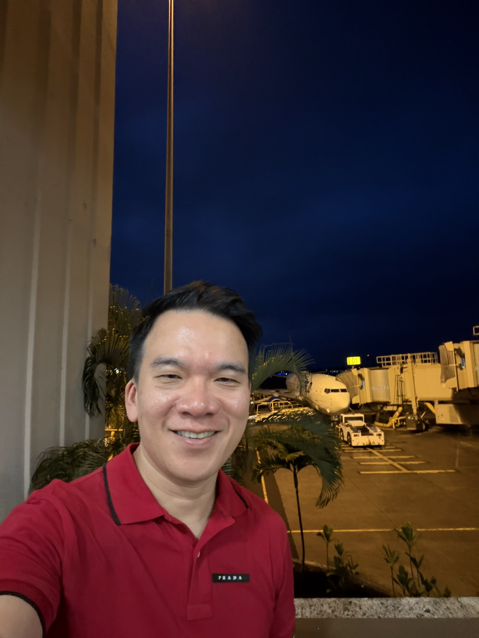 Andrew at Honolulu airport at night before the Island Hopper flight