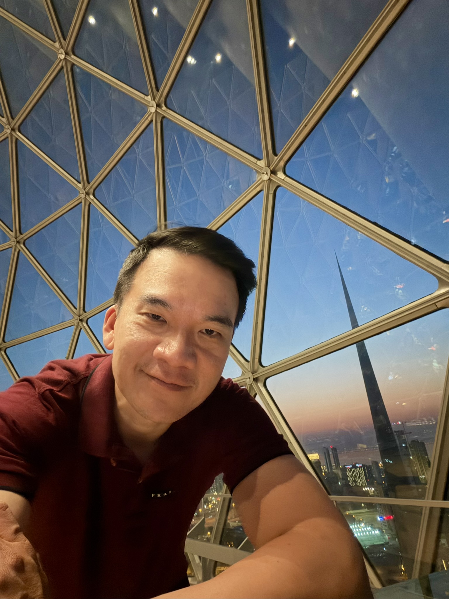 Selfie inside the Kuwait Towers glass observation dome at dusk