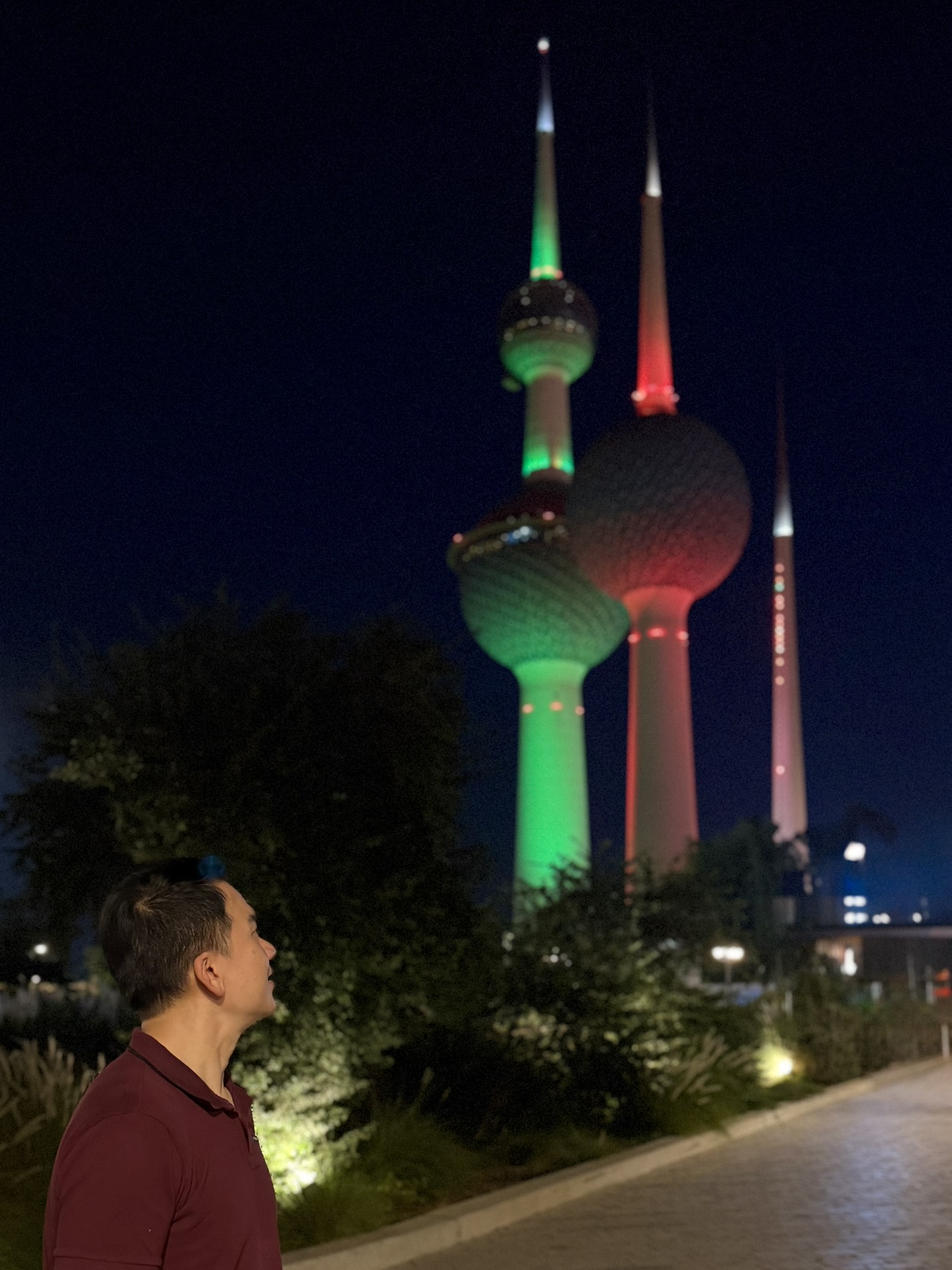 Watching the Kuwait Towers glow green, red, and white at night
