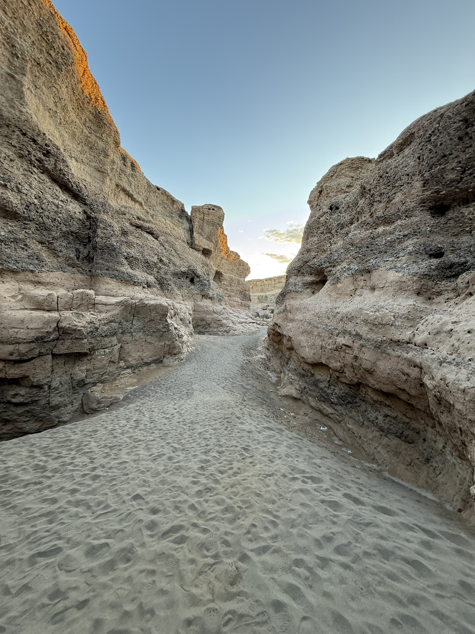 Sesriem Canyon with sandy floor between rock walls