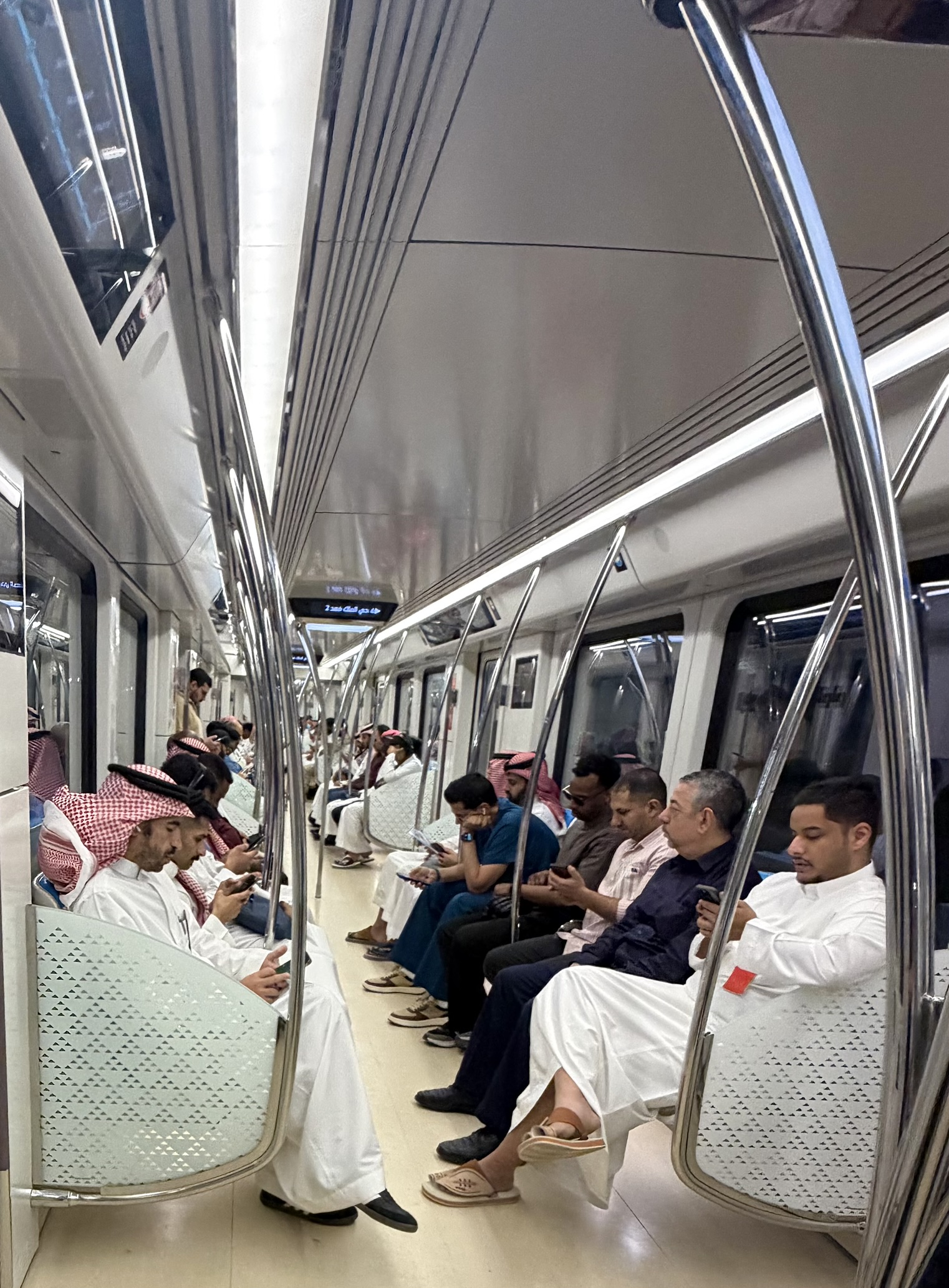 Inside metro car with passengers