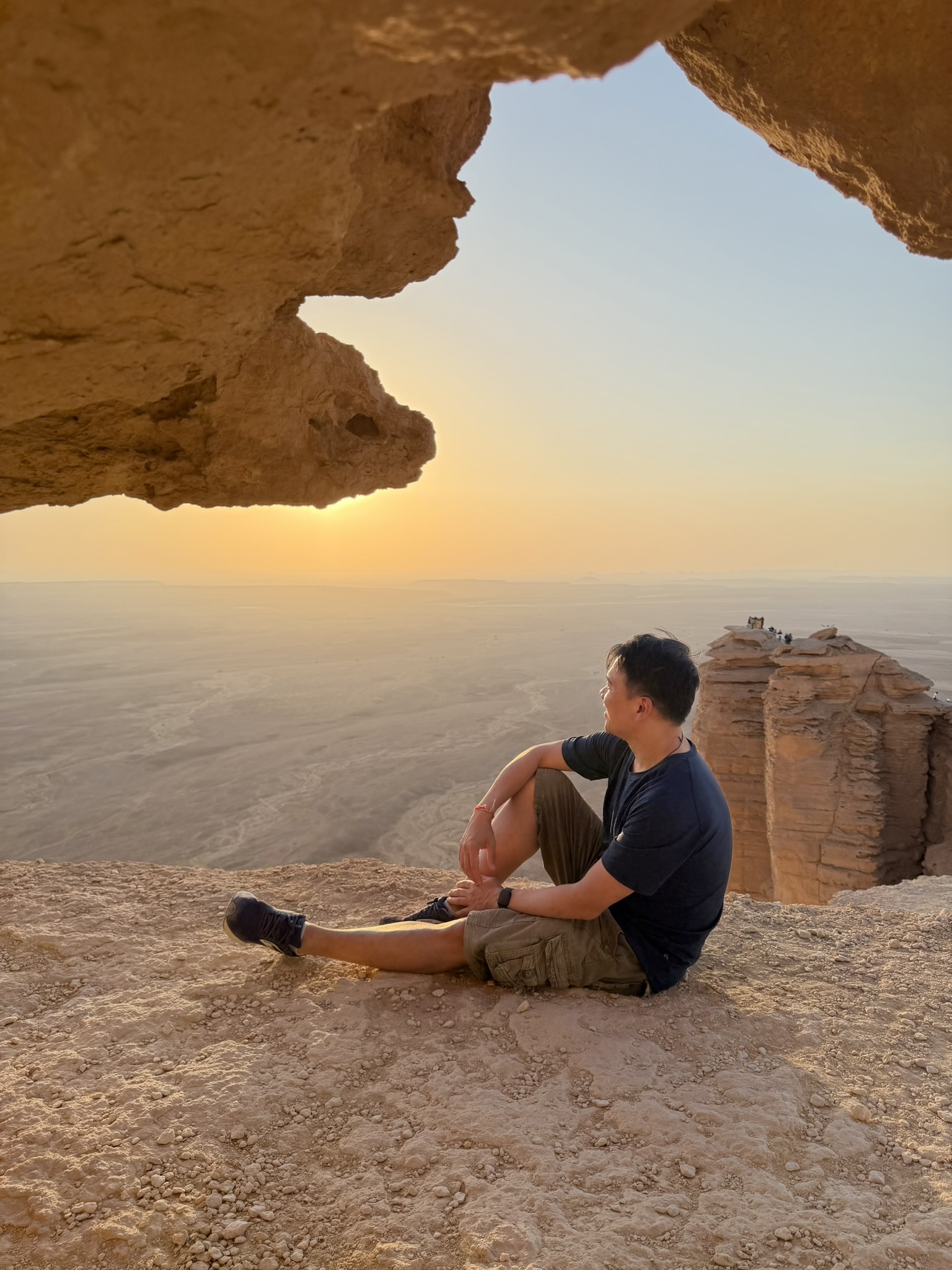 Sitting under rock overhang at Edge of the World
