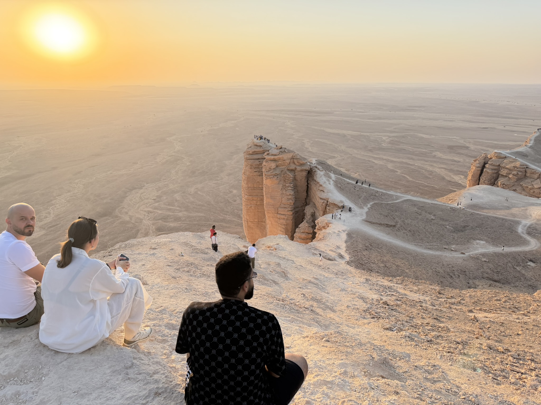 Visitors watching sunset at Edge of the World