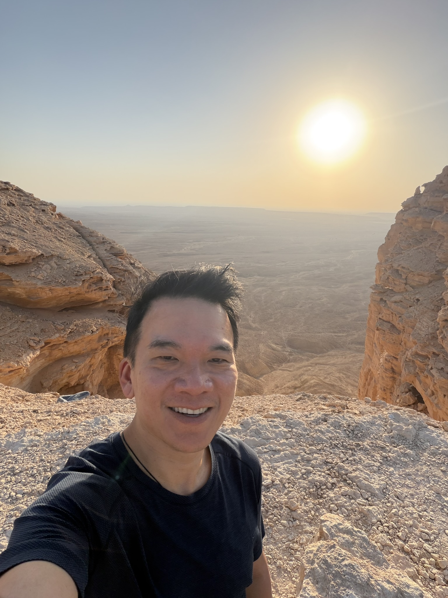Selfie at Edge of the World with sun behind