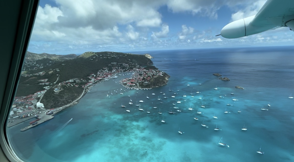 Aerial view from plane window of St. Barts harbor